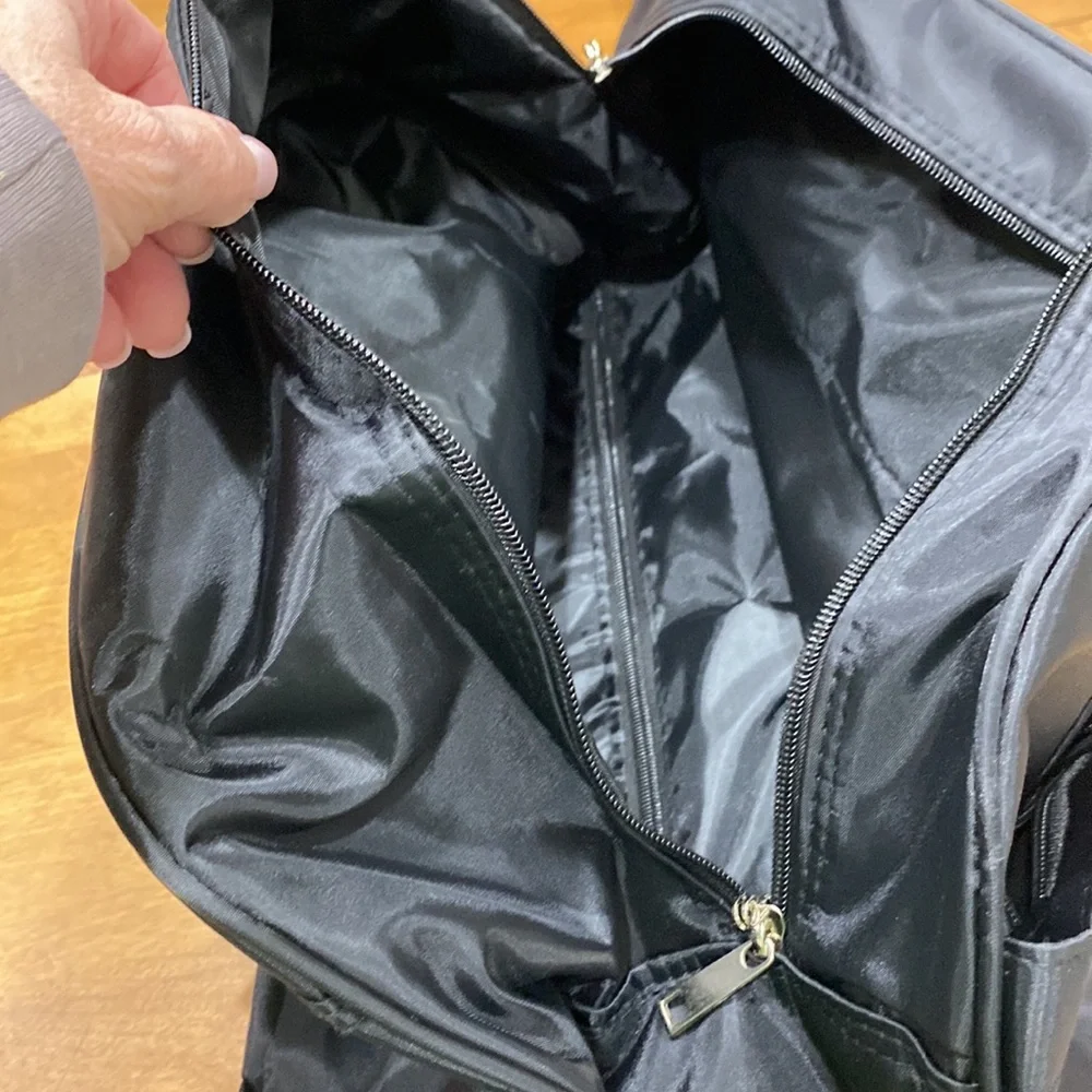 NWOT. Nylon rolling carry-on bag.
